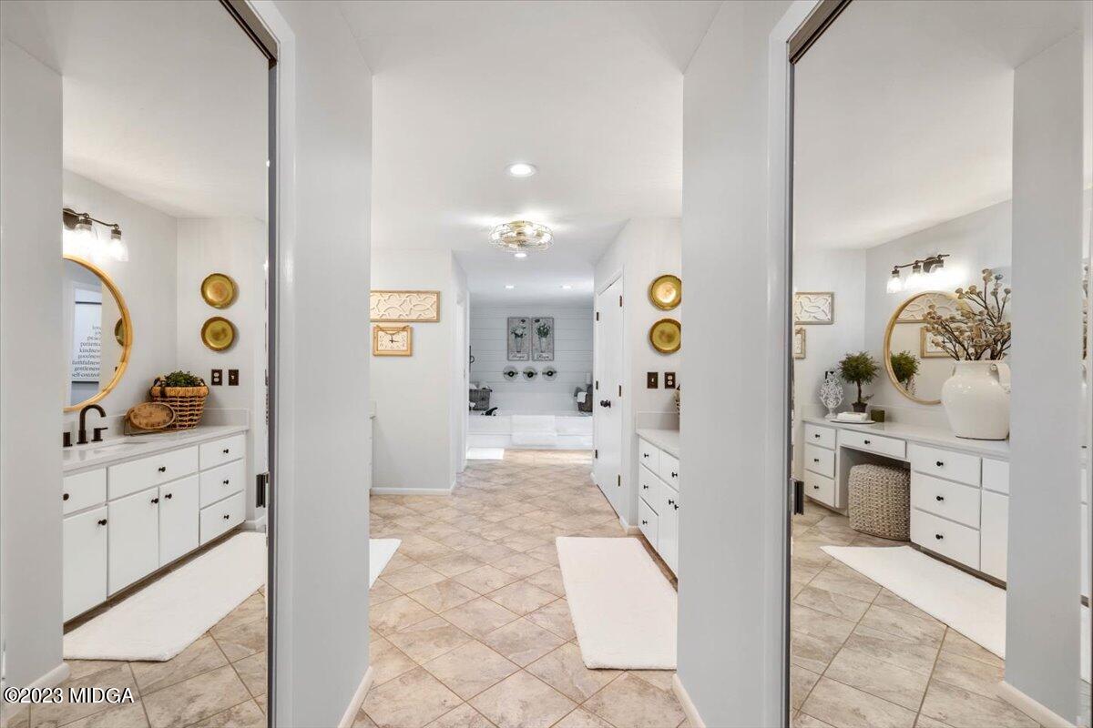 724 Forest Hill Road Macon, GA 31210 - Photo 29 of 46 a bathroom with a sink and mirror with shower