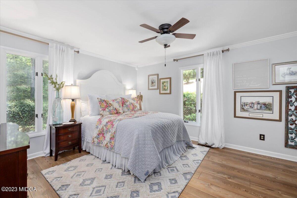 724 Forest Hill Road Macon, GA 31210 - Photo 33 of 46 a bedroom with a large bed and a window