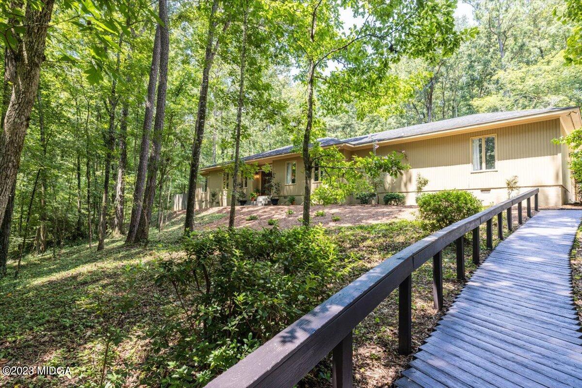 724 Forest Hill Road Macon, GA 31210 - Photo 35 of 46 a view of a bench in a balcony