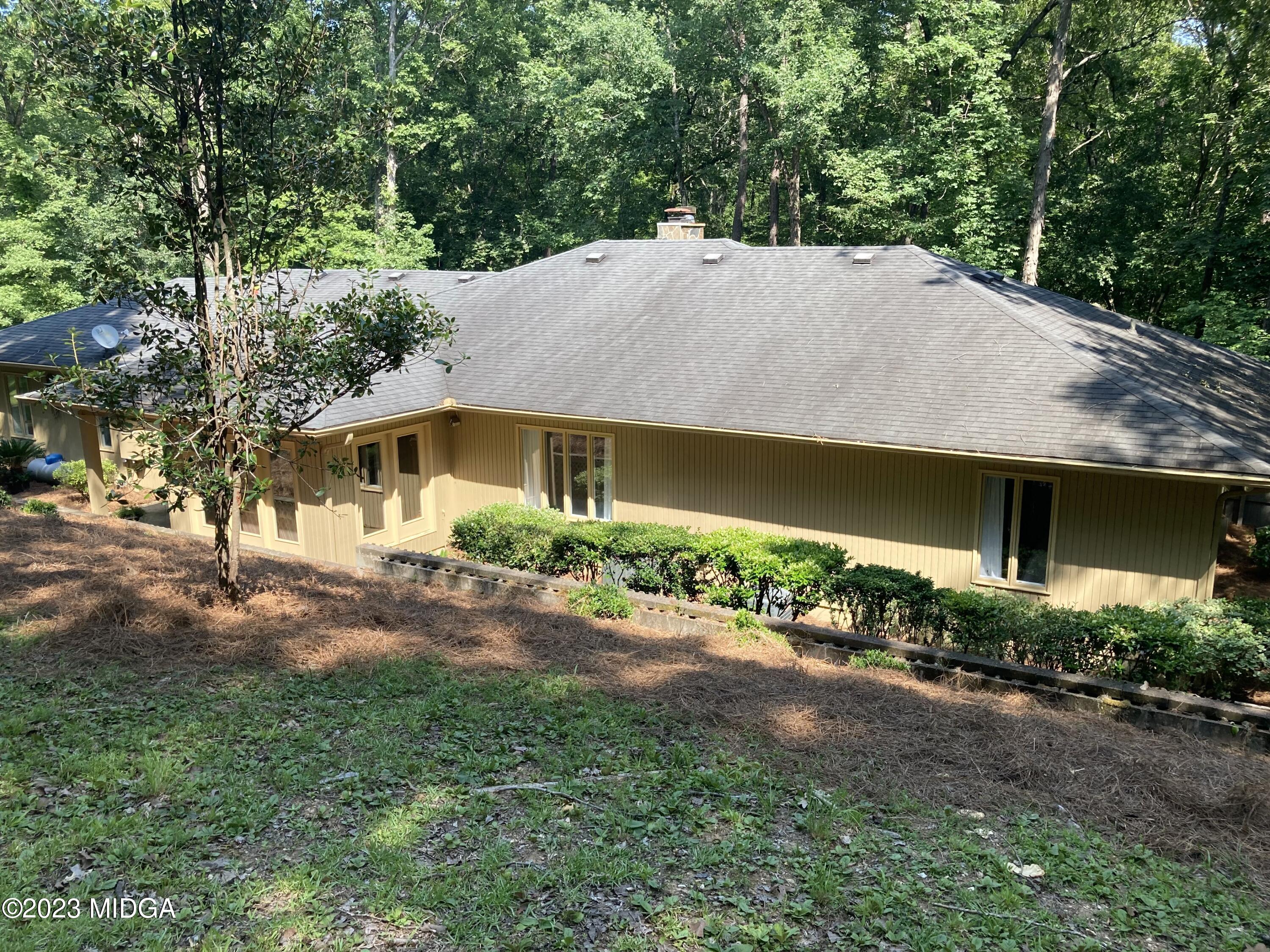 724 Forest Hill Road Macon, GA 31210 - Photo 45 of 46 a aerial view of a house with a yard and garage