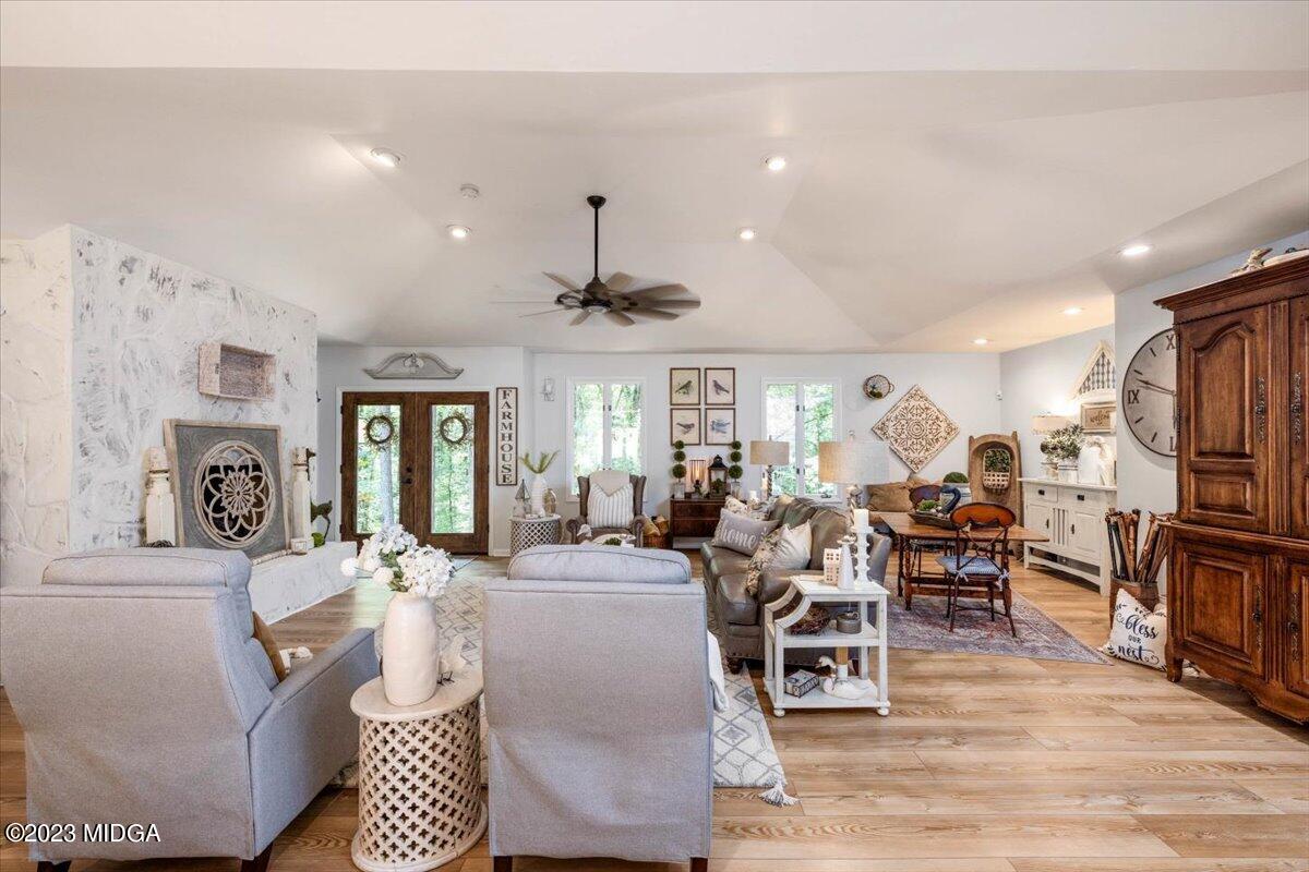 724 Forest Hill Road Macon, GA 31210 - Photo 7 of 46 a living room with lots of furniture and kitchen view