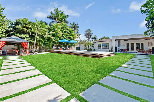a front view of a house with a yard table and chairs