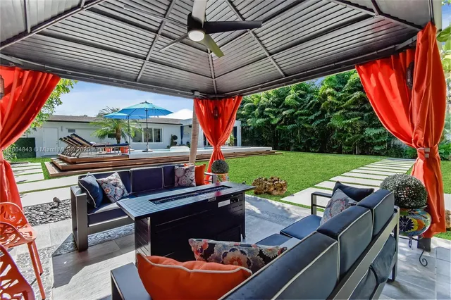 a view of a patio with couches chairs and a table and chairs