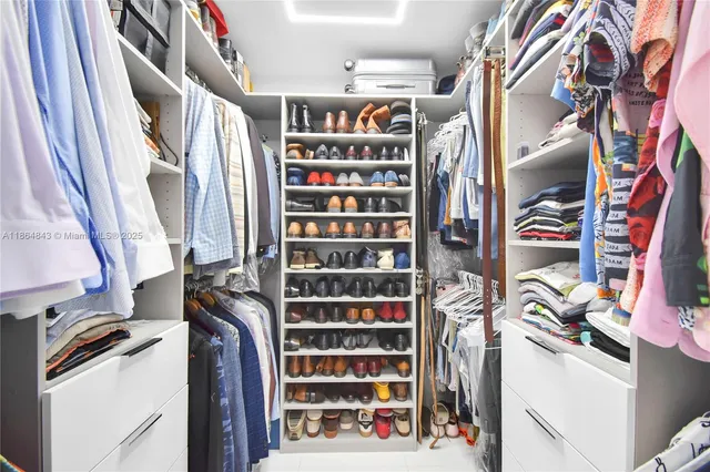 a bathroom with a toilet sink and shower