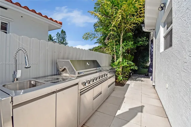 a view of a house with a yard patio and swimming pool