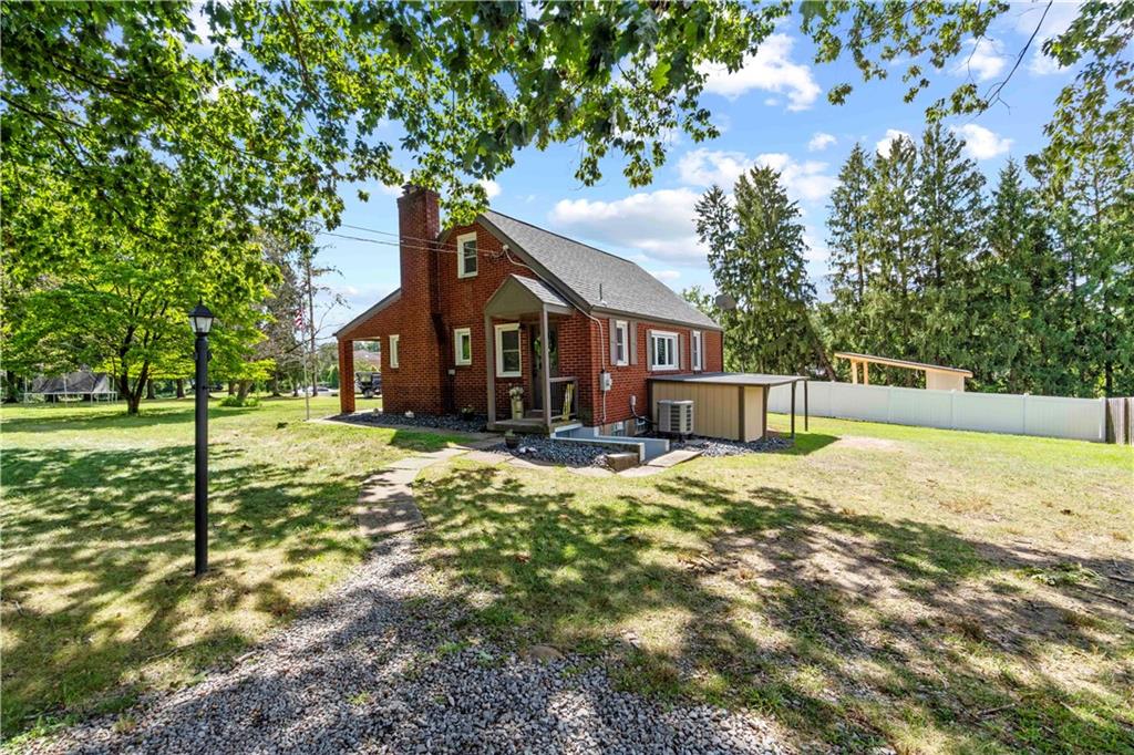 12680 Veronica Lane Irwin, PA 15642 - Photo 2 of 29 a view of a house with backyard and tree