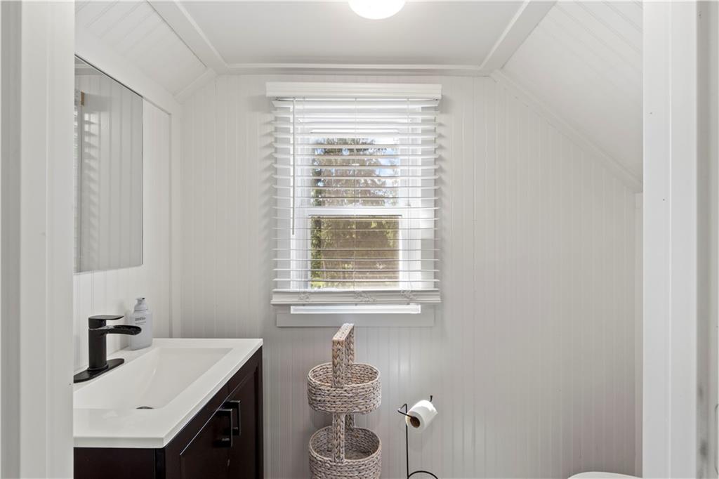 12680 Veronica Lane Irwin, PA 15642 - Photo 24 of 29 a bathroom with a sink vanity granite toilet and a window