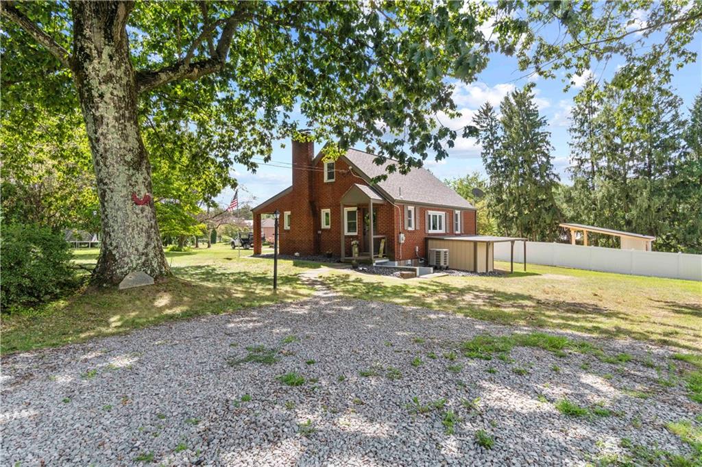 12680 Veronica Lane Irwin, PA 15642 - Photo 3 of 29 a house with trees in the background