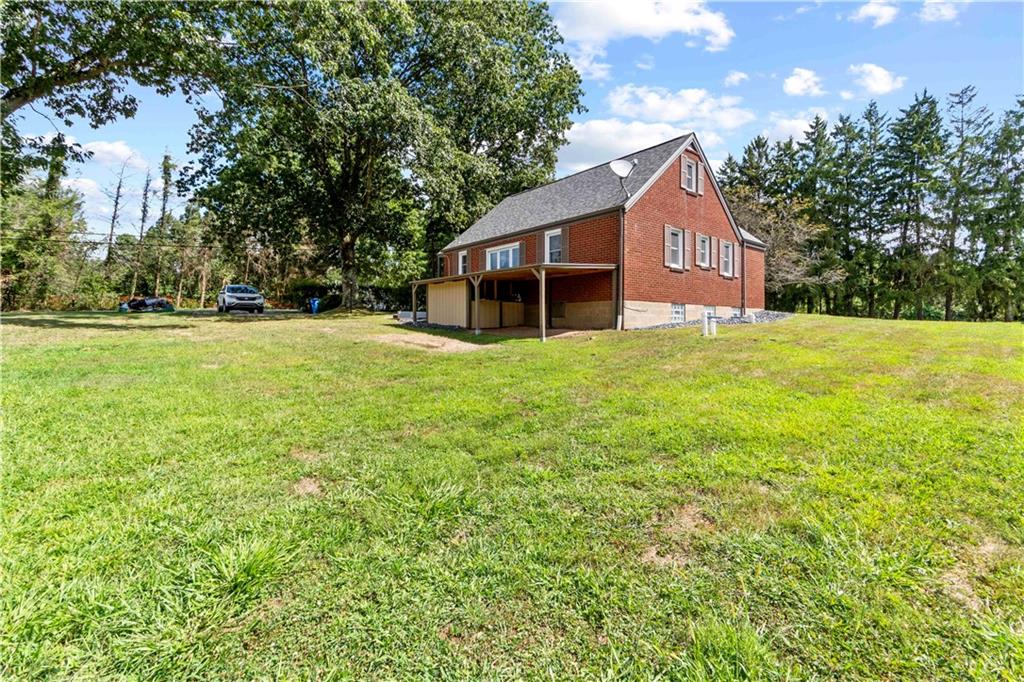 12680 Veronica Lane Irwin, PA 15642 - Photo 4 of 29 a house with huge green field in front of it