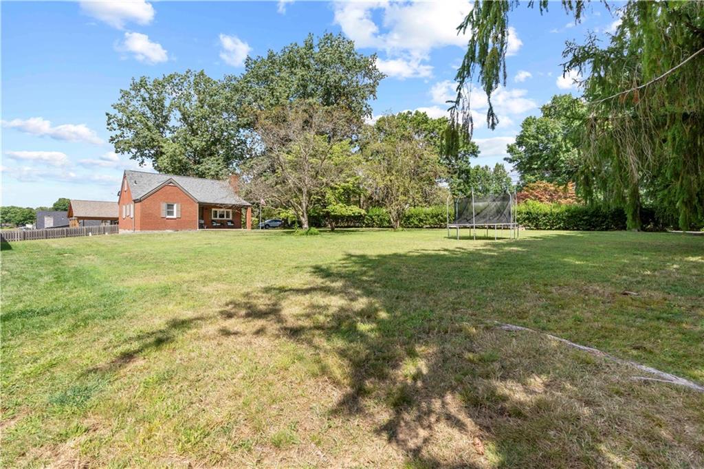 12680 Veronica Lane Irwin, PA 15642 - Photo 5 of 29 a house with a yard and a large tree