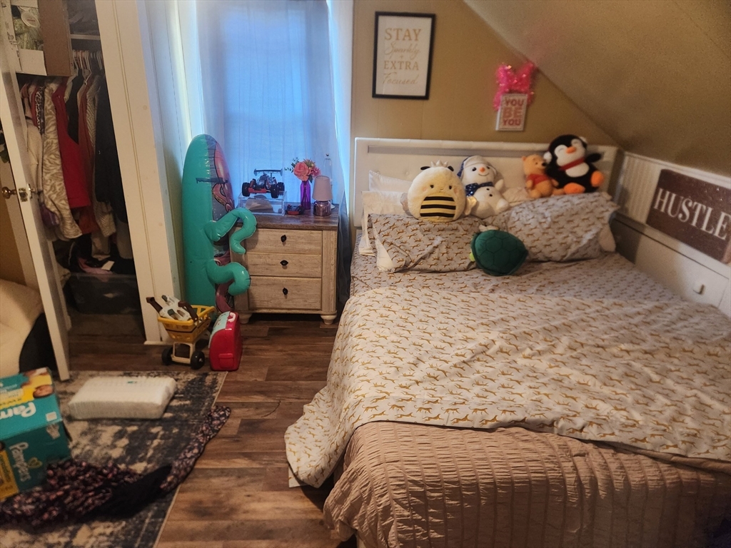 53 Temple Street Spencer, MA 01562 - Photo 16 of 20 a bedroom with a bed and cabinets