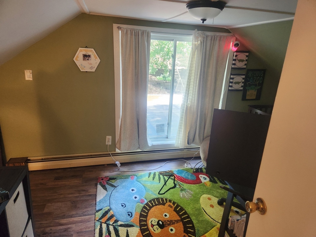 53 Temple Street Spencer, MA 01562 - Photo 17 of 20 a room with window and air hockey table