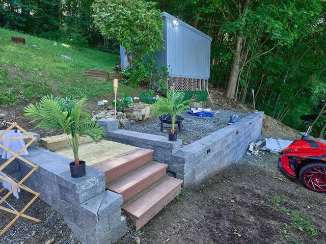 a backyard of a house with lots of green space