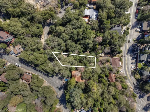 a aerial view of a house with a yard