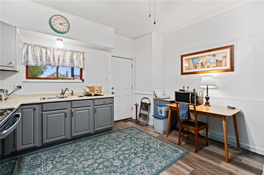 1630 Poplar Avenue Braddock, PA 15104 - Photo 12 of 25 a view of a workspace with furniture and a rug