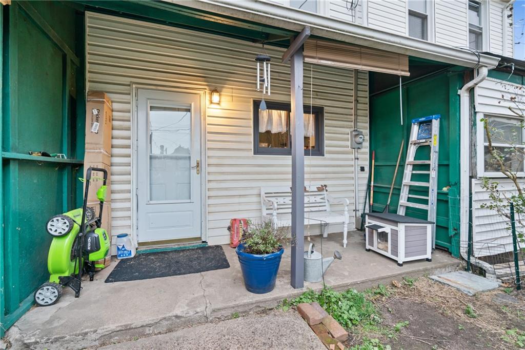 1630 Poplar Avenue Braddock, PA 15104 - Photo 22 of 25 a front view of a house with garden
