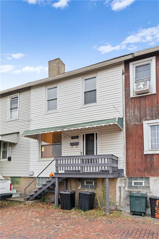 1630 Poplar Avenue Braddock, PA 15104 - Photo 4 of 25 a view of a large house with wooden stairs