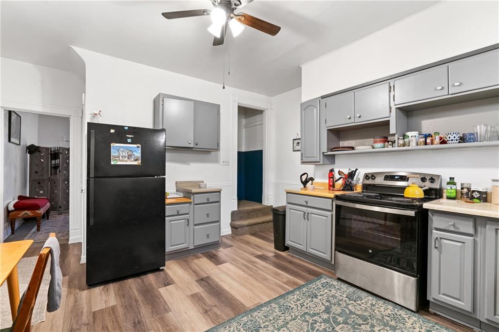 1630 Poplar Avenue Braddock, PA 15104 - Photo 10 of 25 a kitchen with stainless steel appliances granite countertop a refrigerator a stove and a sink