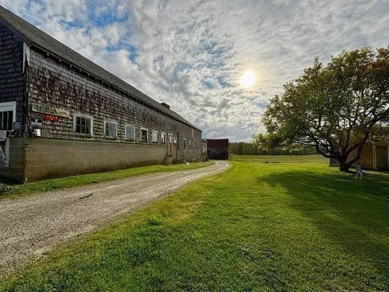 a view of house with backyard