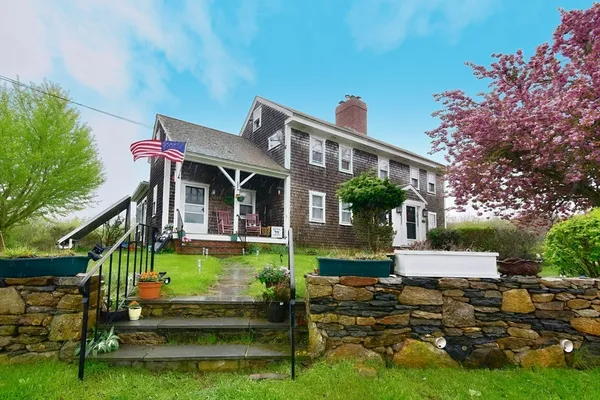 a front view of a house with garden