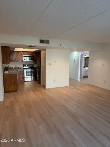 a view of a kitchen with a stove cabinets and wooden floor