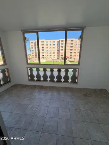 a view of an empty room with a window