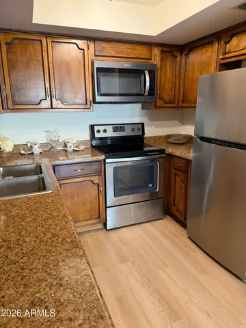 a kitchen with a stove and a microwave