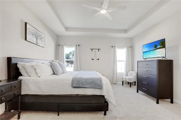 a bedroom with a bed and cabinet