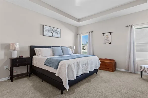 a bedroom with a bed and lamp