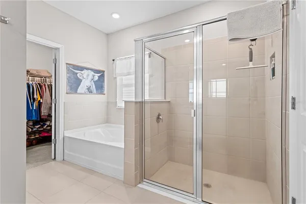 a bathroom with a bathtub and a shower