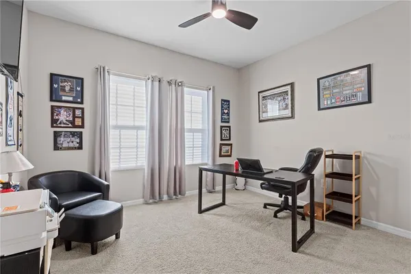 a workspace with a couch and a window