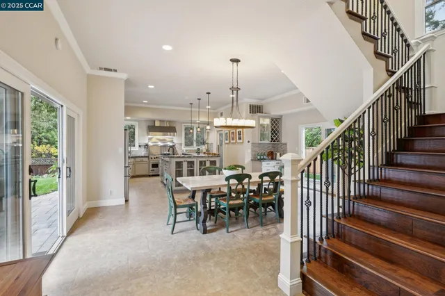 a dining room with furniture window and wooden floor