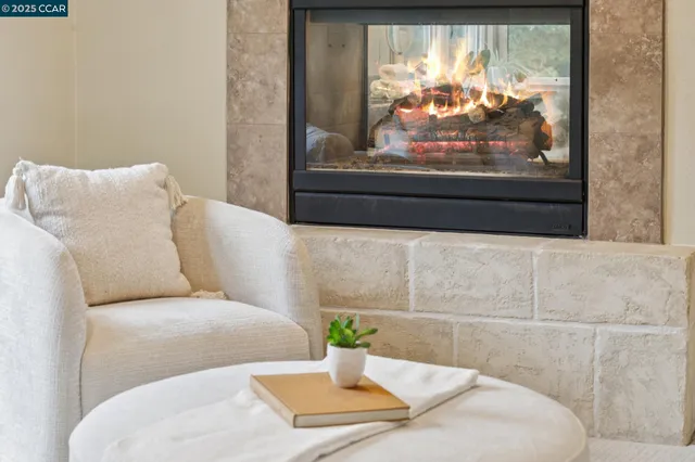 a large white kitchen with cabinets