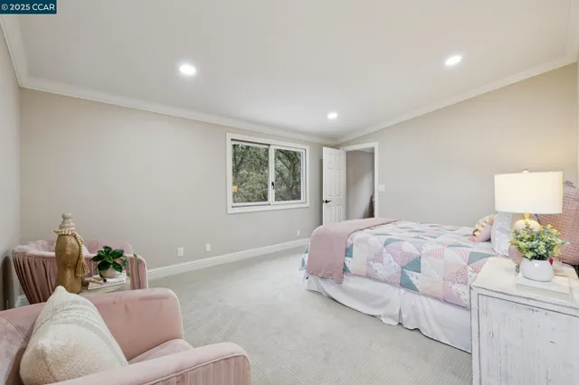 a view of a house with swimming pool and sitting area