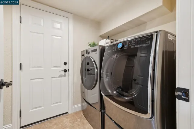 a view of a patio with couches and a table and chairs with garden view