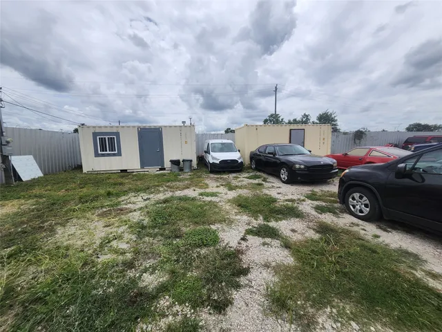 a view of a car in front of a house