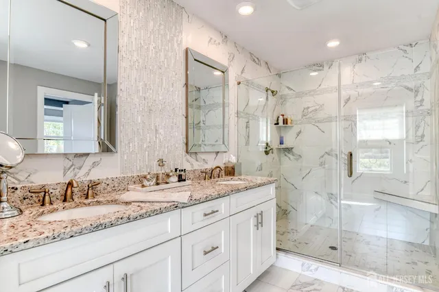 a bathroom with a bathtub and shower
