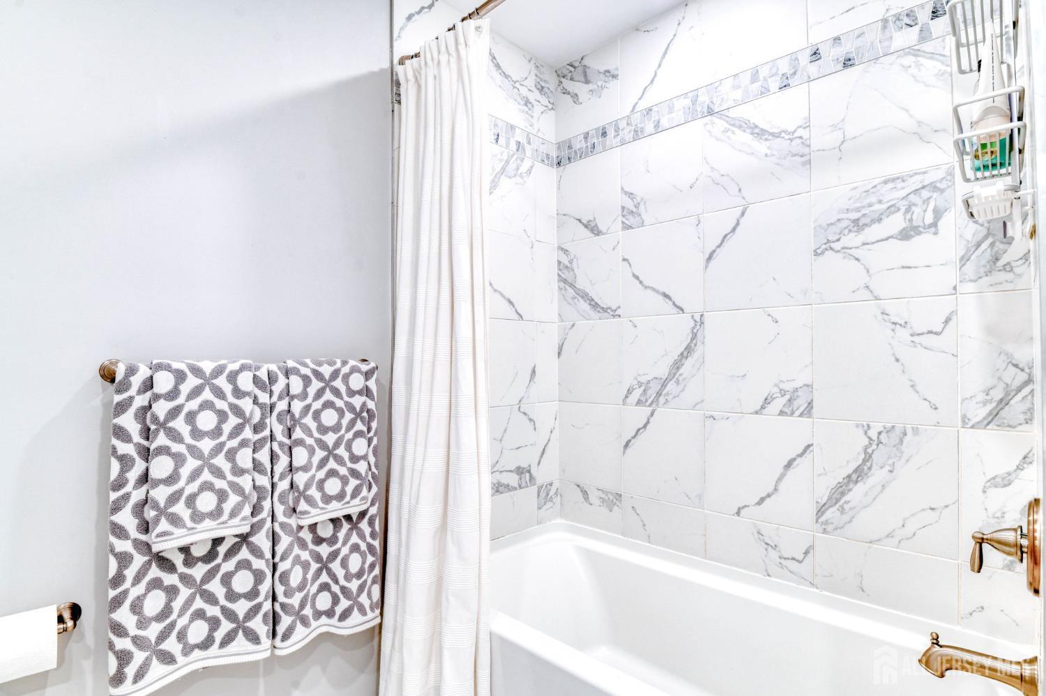 1529 Paxton Lane Monroe Township, NJ 08831 - Photo 14 of 36 a bathroom with a bathtub and shower