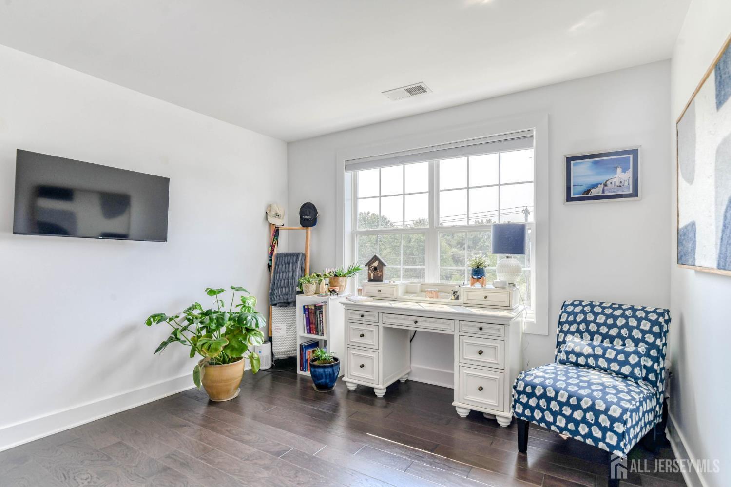 1529 Paxton Lane Monroe Township, NJ 08831 - Photo 17 of 36 a room with furniture and a potted plant