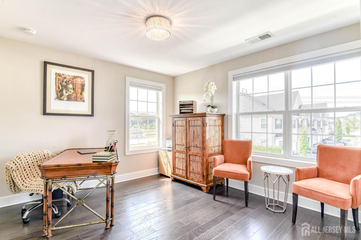 1529 Paxton Lane Monroe Township, NJ 08831 - Photo 20 of 36 a living room with furniture and a wooden floor