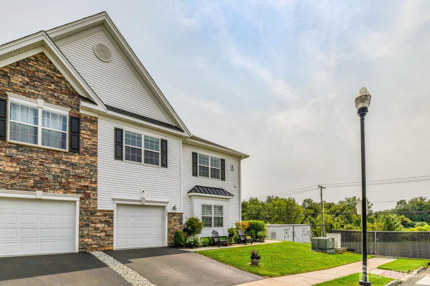 1529 Paxton Lane Monroe Township, NJ 08831 - Photo 2 of 36 a front view of a house with a yard