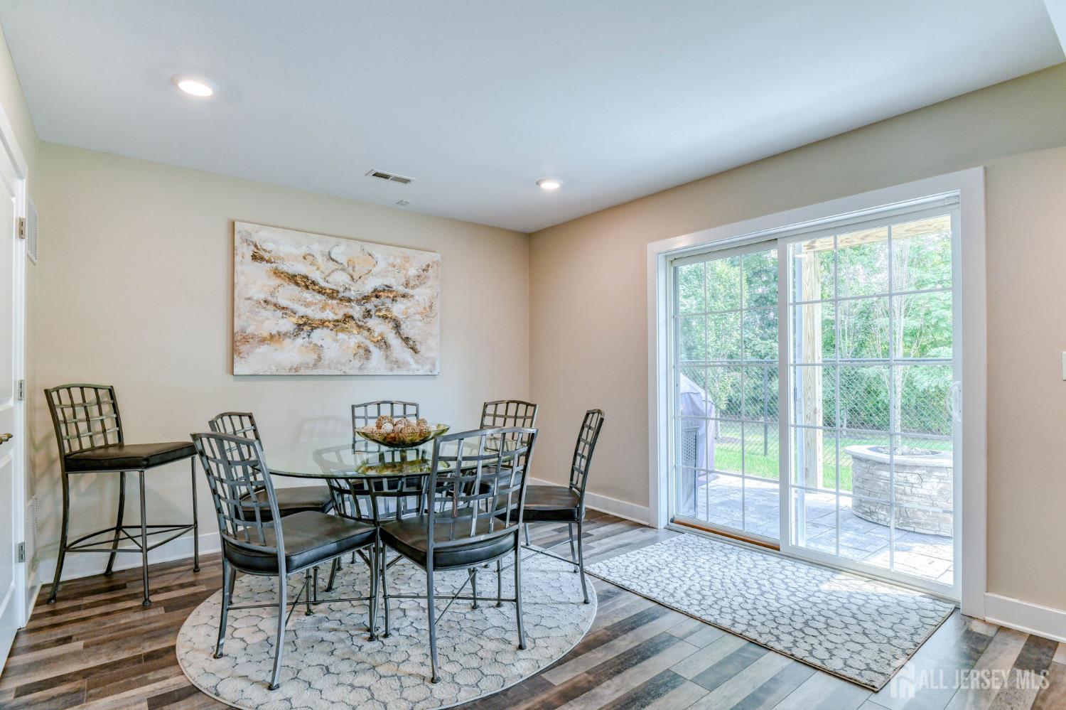 1529 Paxton Lane Monroe Township, NJ 08831 - Photo 23 of 36 a view of a dining room with furniture window and wooden floor