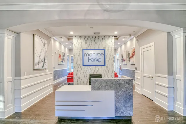 a living room with furniture pool table and a large window