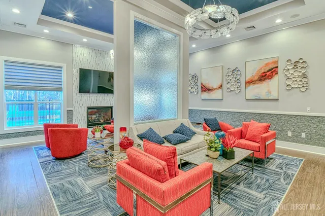 a living room with fireplace furniture and a window