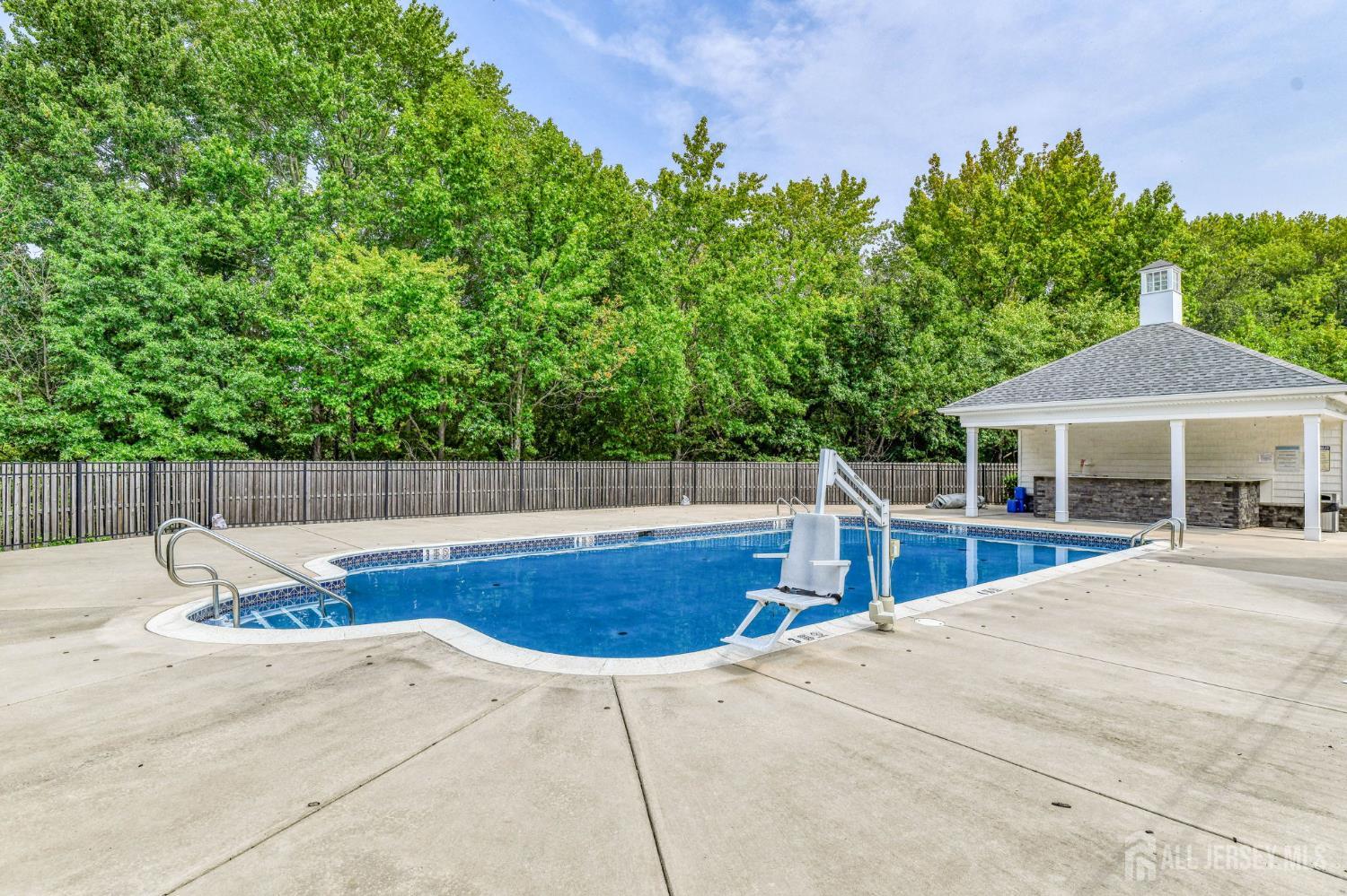 1529 Paxton Lane Monroe Township, NJ 08831 - Photo 36 of 36 a view of a swimming pool with a patio