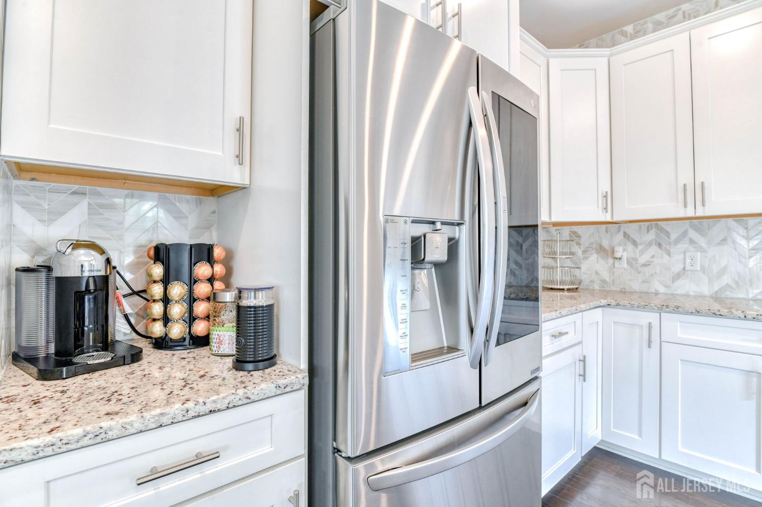 1529 Paxton Lane Monroe Township, NJ 08831 - Photo 7 of 36 a kitchen with stainless steel appliances granite countertop a refrigerator and a sink