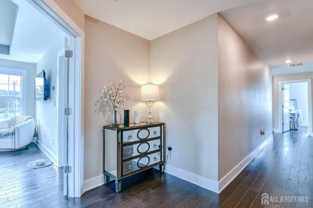 a bedroom with a large bed and a tv