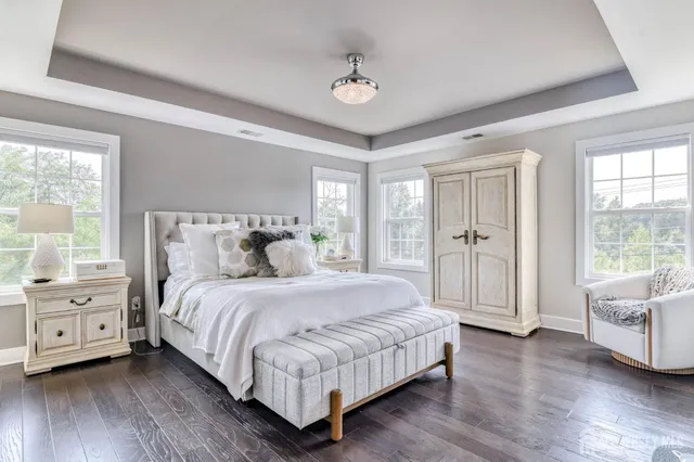 a bathroom with a granite countertop sink mirror shower and double