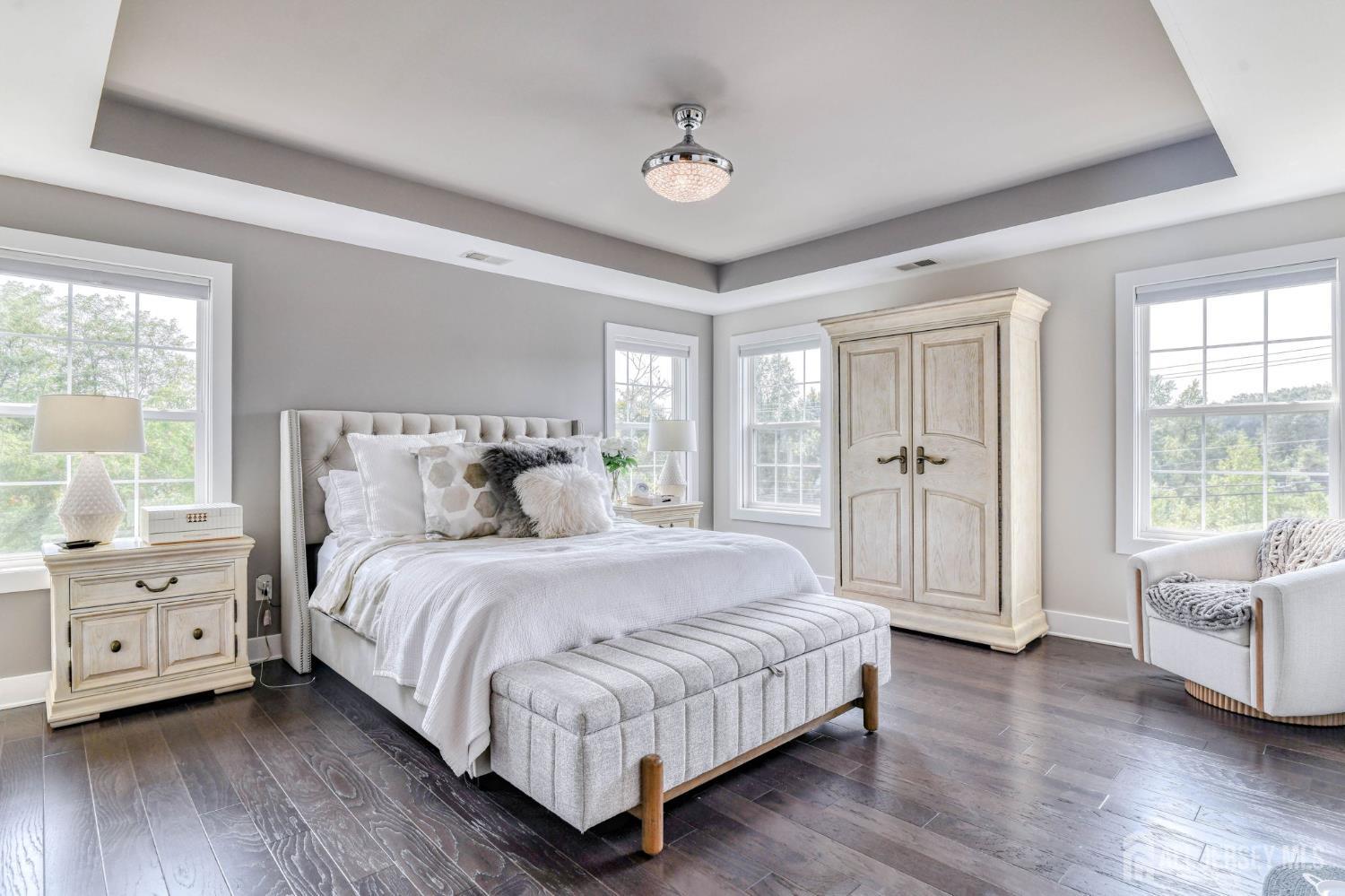 1529 Paxton Lane Monroe Township, NJ 08831 - Photo 10 of 36 a bedroom with a large bed and a couch