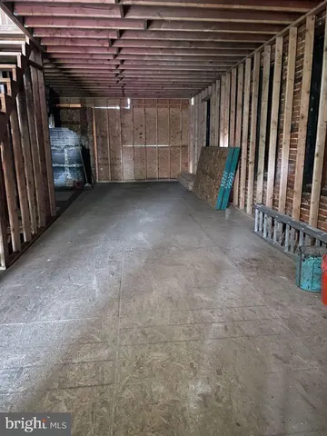 a view of a room with wooden walls